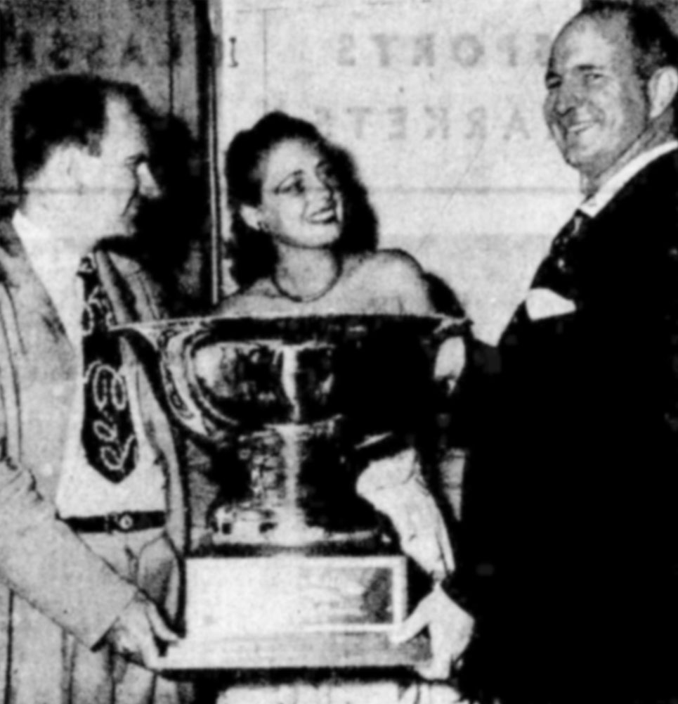 P.J. Henn receives trophy for winning the Biscayne Bay Regatta