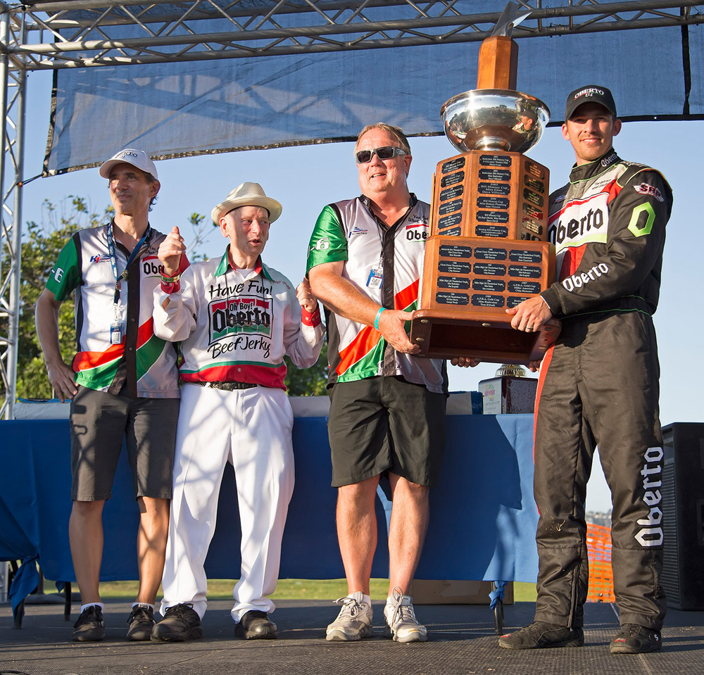 Art Oberto, Larry Oberto and Jimmy Shane accepting the trophy