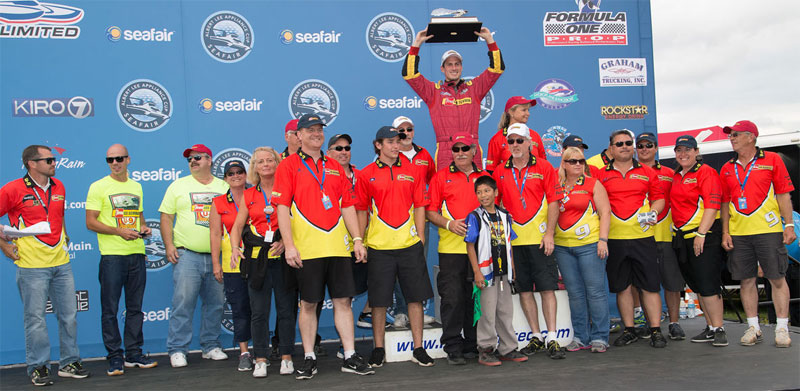 Andrew Tate hoists the Seafair Trophy