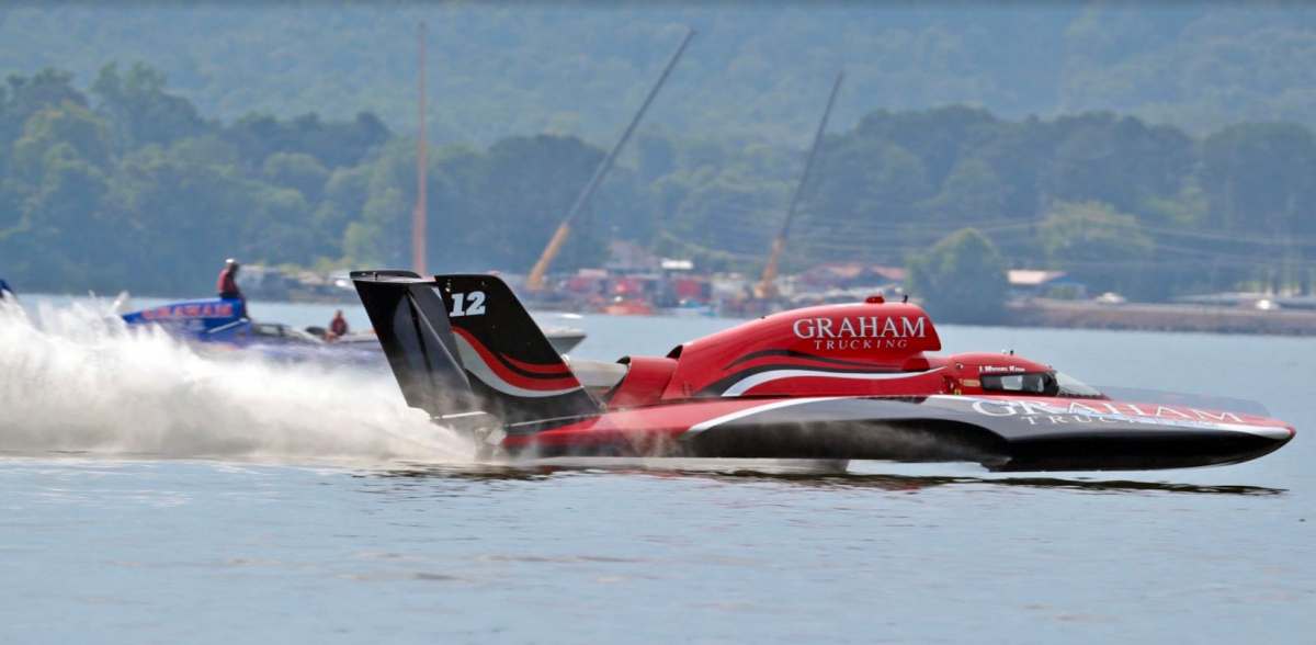 J. Michael Kelly flies by team mate Corey Peabody during qualifying